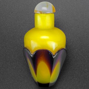 Chinese cased yellow and aubergine Peking glass snuff bottle early 20th C